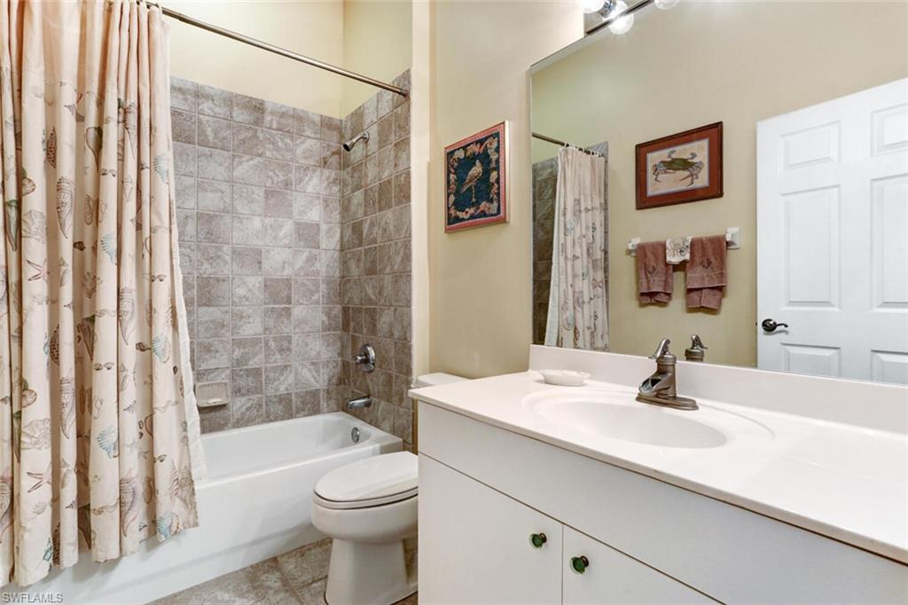 20871 Torrey Pines Way Estero, FL 33928 - Photo 26 of 43 a bathroom with a sink a toilet and shower