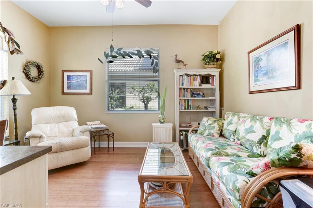 20871 Torrey Pines Way Estero, FL 33928 - Photo 27 of 43 a living room with furniture and window