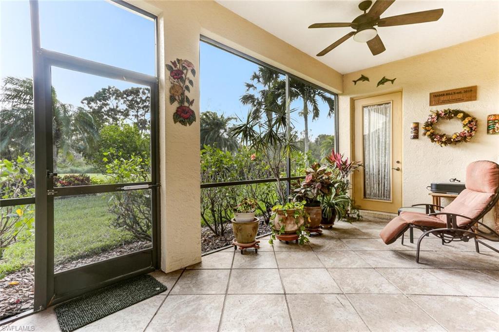 20871 Torrey Pines Way Estero, FL 33928 - Photo 30 of 43 a view of a porch with furniture and a yard