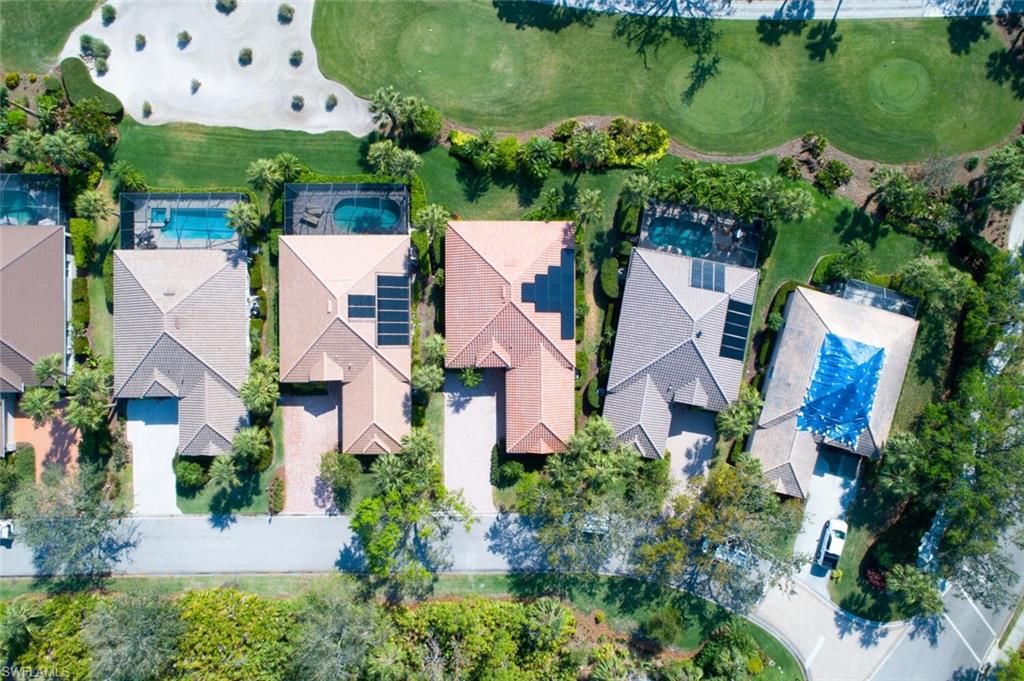 20871 Torrey Pines Way Estero, FL 33928 - Photo 3 of 43 an aerial view of house with yard swimming pool and outdoor seating