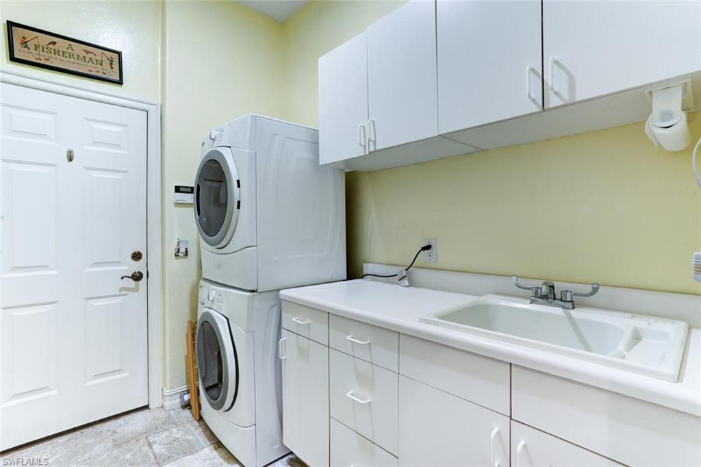 20871 Torrey Pines Way Estero, FL 33928 - Photo 31 of 43 a utility room with dryer and washer