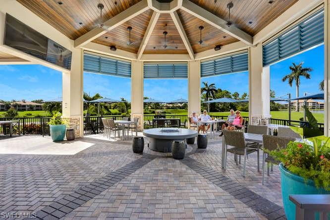 20871 Torrey Pines Way Estero, FL 33928 - Photo 36 of 43 a building outdoor space with patio furniture and potted plants