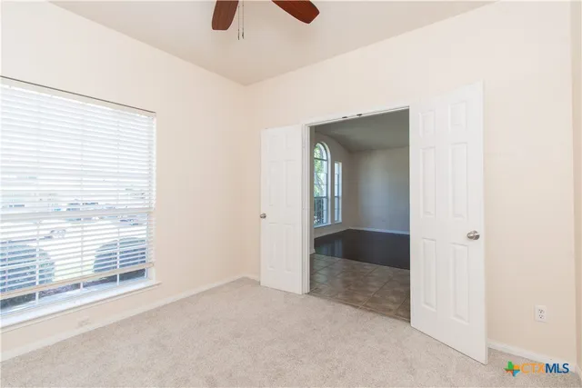 a view of an empty room and window