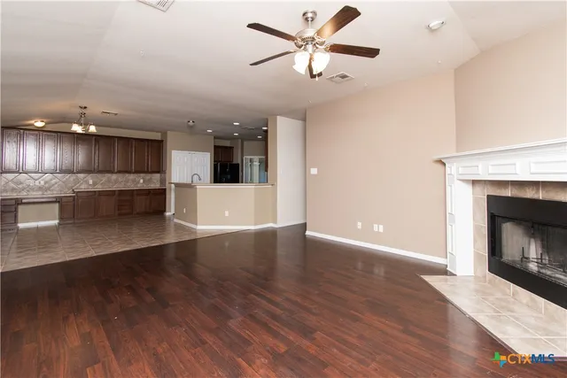 a view of a kitchen with a dishwasher and a fireplace