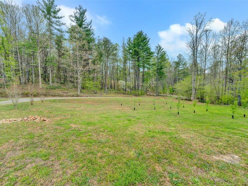 2628 Republican Church Road Ferrum, VA 24088 - Photo 22 of 23 a backyard of a house with lots of green space and trees