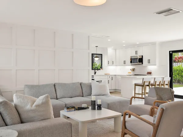 a living room with furniture and a window