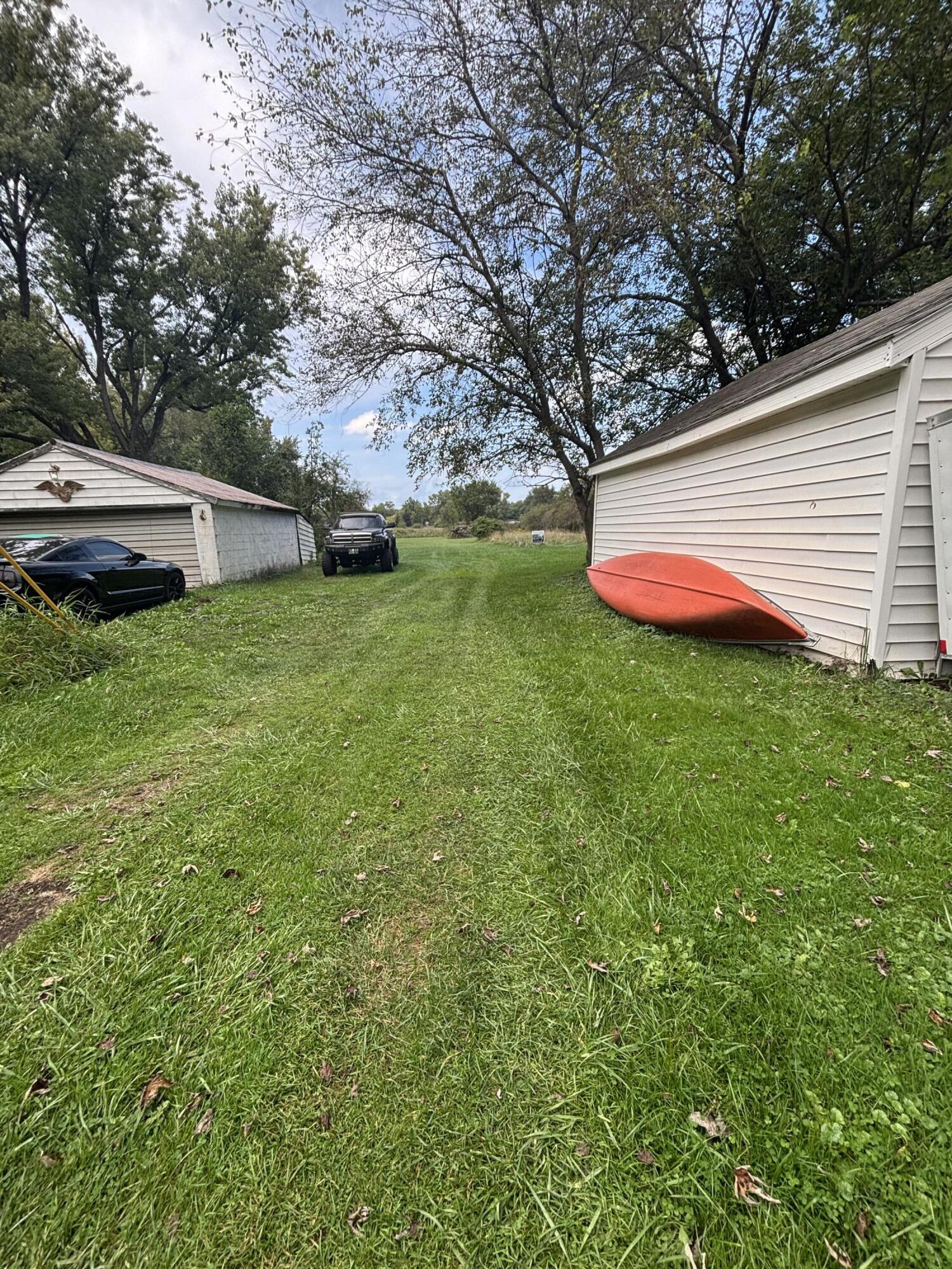 4300 Roosevelt Place Gary, IN 46408 - Photo 4 of 5 a backyard of a house with lots of green space and fountain