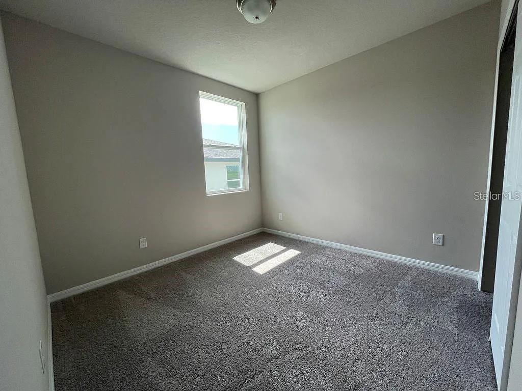 1274 Citrus Landings Boulevard Davenport, FL 33837 - Photo 8 of 20 an empty room with a window