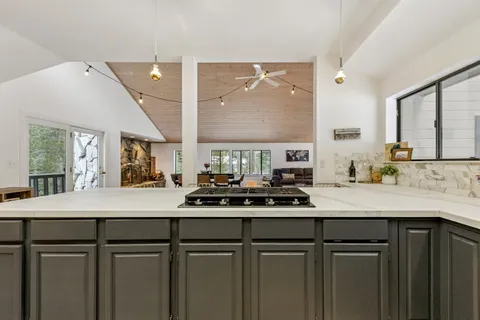 a kitchen with a sink and cabinets