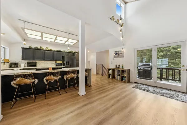 a view of a dining room with furniture window and wooden floor