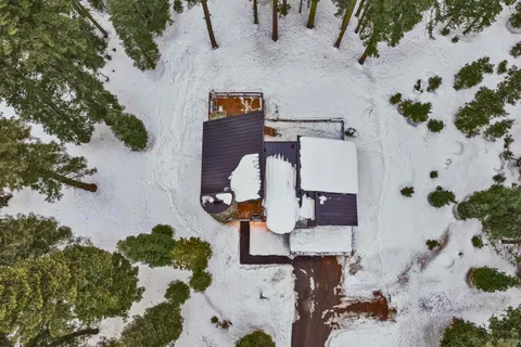 an aerial view of houses with yard