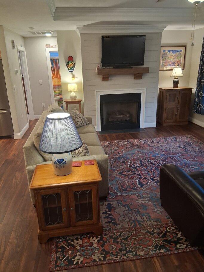 2348 East Ruritan Road Roanoke, VA 24012 - Photo 15 of 31 a living room with furniture a flat screen tv and a fireplace