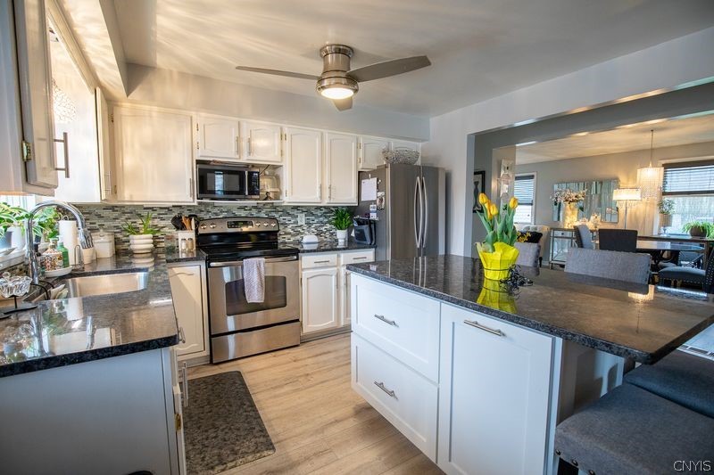 110 Leicestershire Road Irondequoit, NY 14621 - Photo 5 of 26 Remodeled kitchen with custom island, granite cou