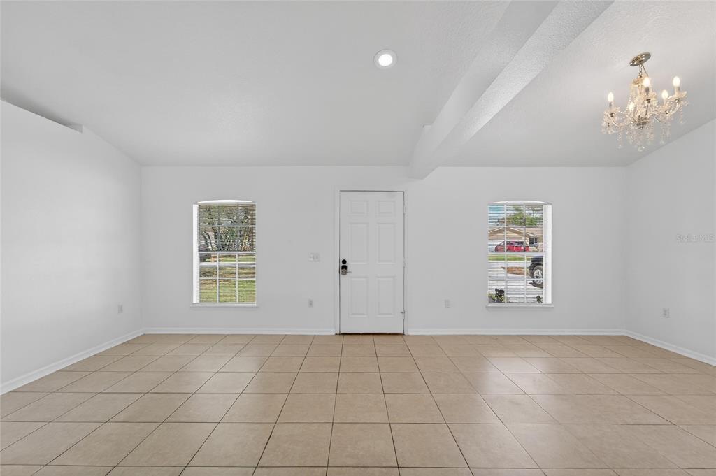 9010 Mc Cormick Street Spring Hill, FL 34608 - Photo 13 of 73 an empty room with windows and closet