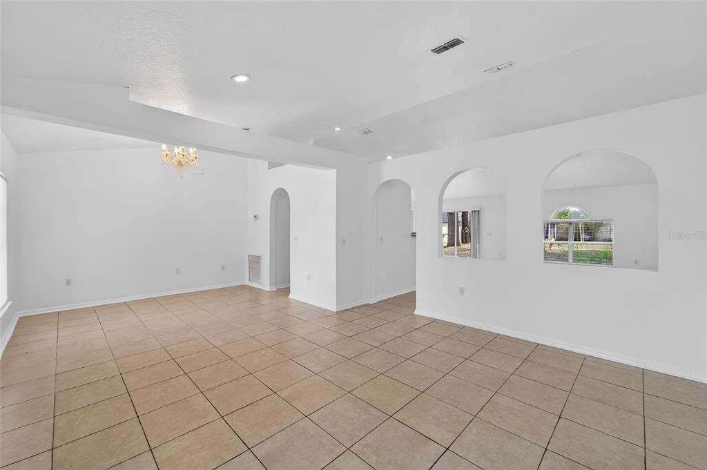 9010 Mc Cormick Street Spring Hill, FL 34608 - Photo 16 of 73 a view of an empty room with a window