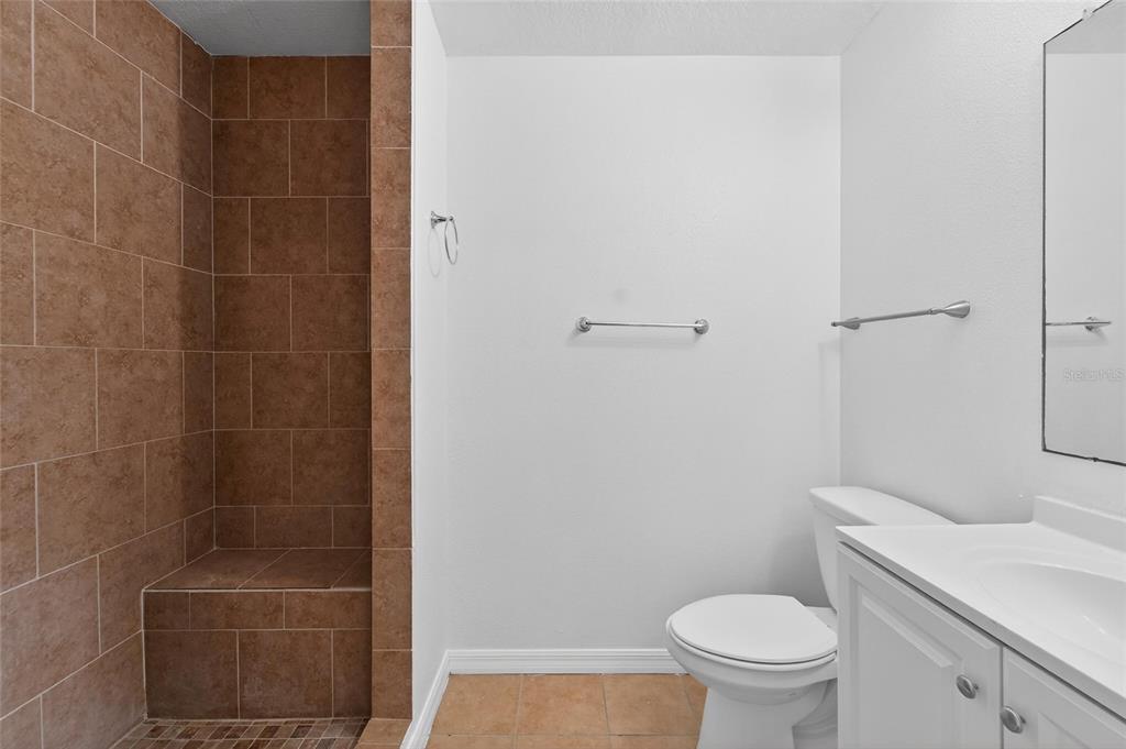 9010 Mc Cormick Street Spring Hill, FL 34608 - Photo 38 of 73 a bathroom with a toilet and a shower