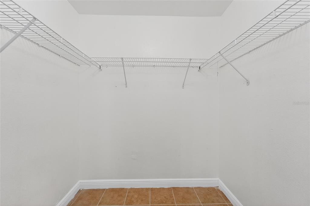 9010 Mc Cormick Street Spring Hill, FL 34608 - Photo 42 of 73 a view of a room with racks on the wall