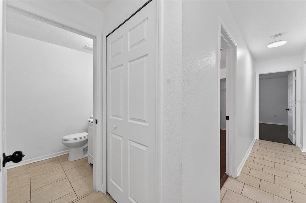 9010 Mc Cormick Street Spring Hill, FL 34608 - Photo 55 of 73 a bathroom with a granite countertop sink toilet and shower