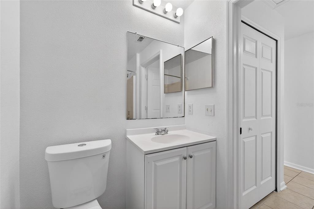 9010 Mc Cormick Street Spring Hill, FL 34608 - Photo 60 of 73 a bathroom with a sink a toilet and shower