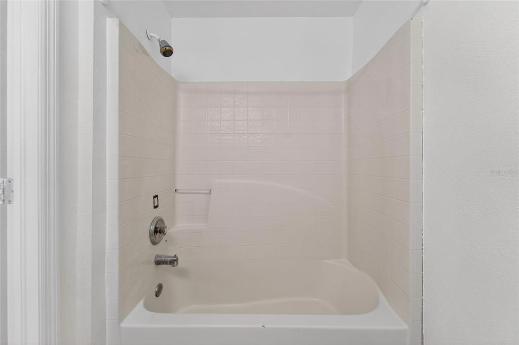 9010 Mc Cormick Street Spring Hill, FL 34608 - Photo 61 of 73 a close up of a bathtub