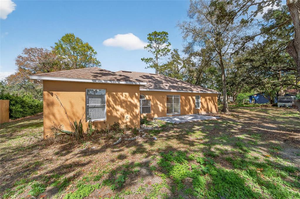 9010 Mc Cormick Street Spring Hill, FL 34608 - Photo 67 of 73 a view of a house with a yard