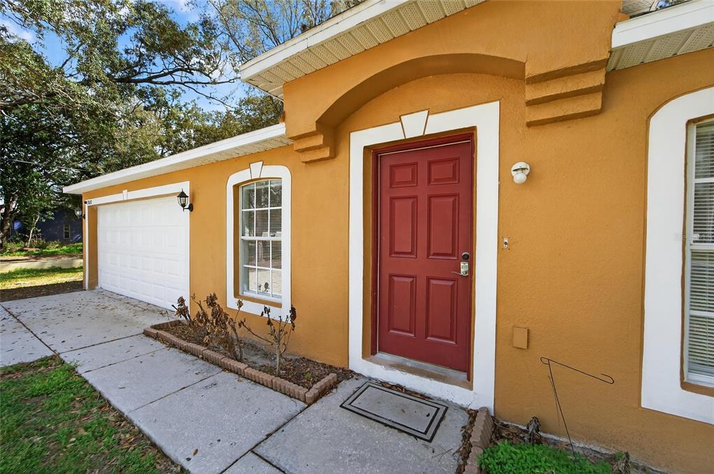 9010 Mc Cormick Street Spring Hill, FL 34608 - Photo 8 of 73 a front view of a house with a yard