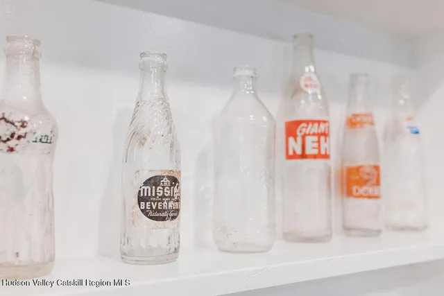 a bathroom with a shower curtain and a sink