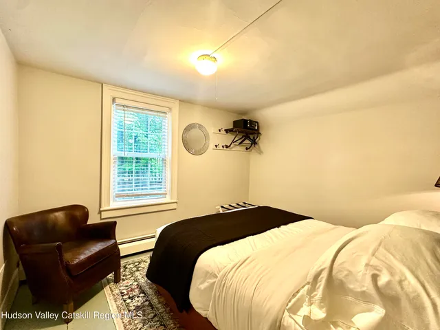 a bedroom with a bed and couch