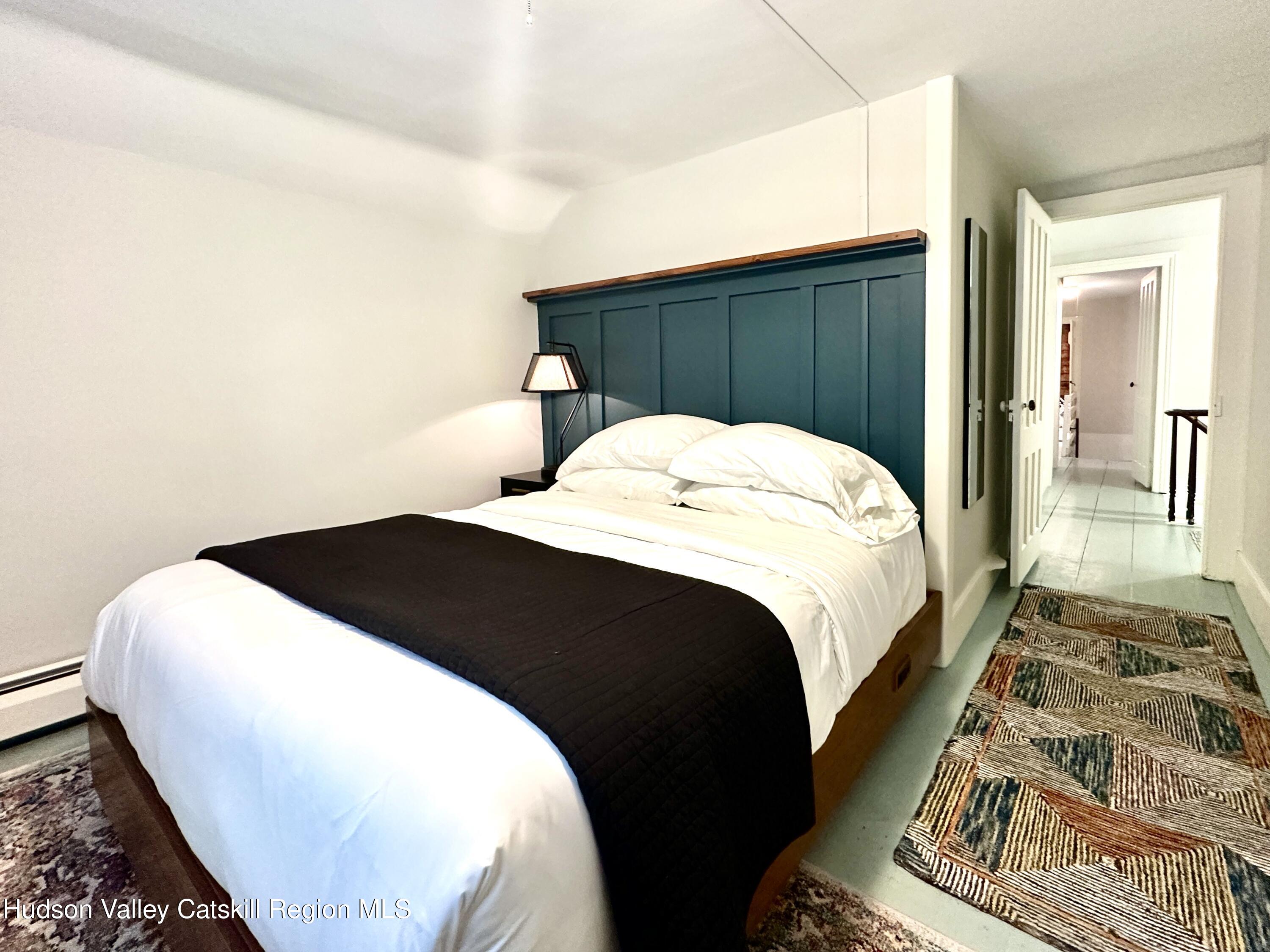 4028 County Rte 26 Greenville, NY 12083 - Photo 25 of 51 a bedroom with a bed and wooden floor