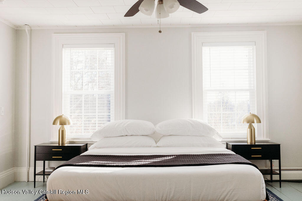 4028 County Rte 26 Greenville, NY 12083 - Photo 27 of 51 a bedroom with a bed and wooden floor