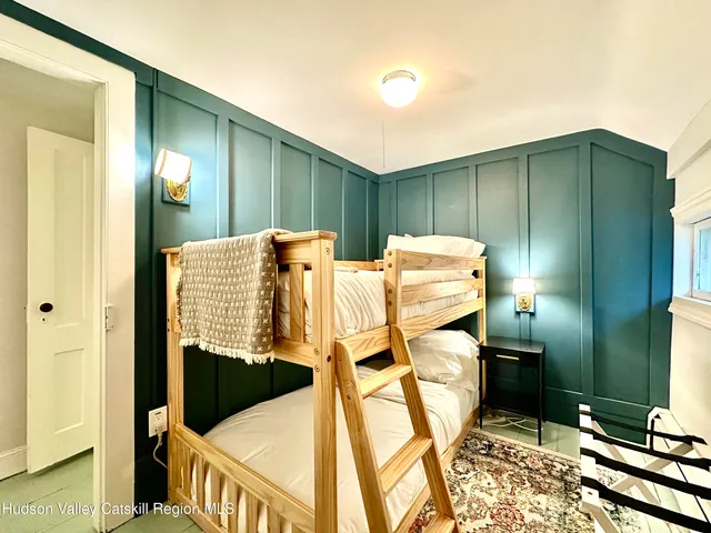 a bathroom with a sink toilet vanity and tub