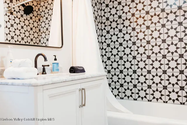 a bedroom with bed and window