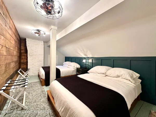 a bedroom with a large bed and a couch