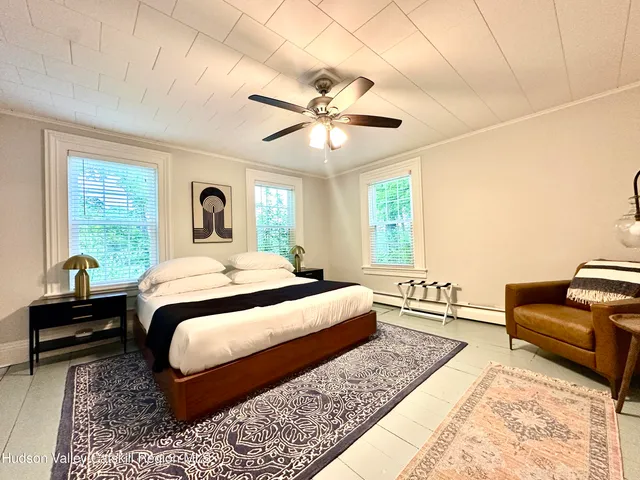 a bedroom with a bed and window