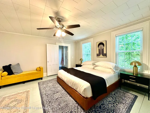 a view of a glass door with a yard from a window