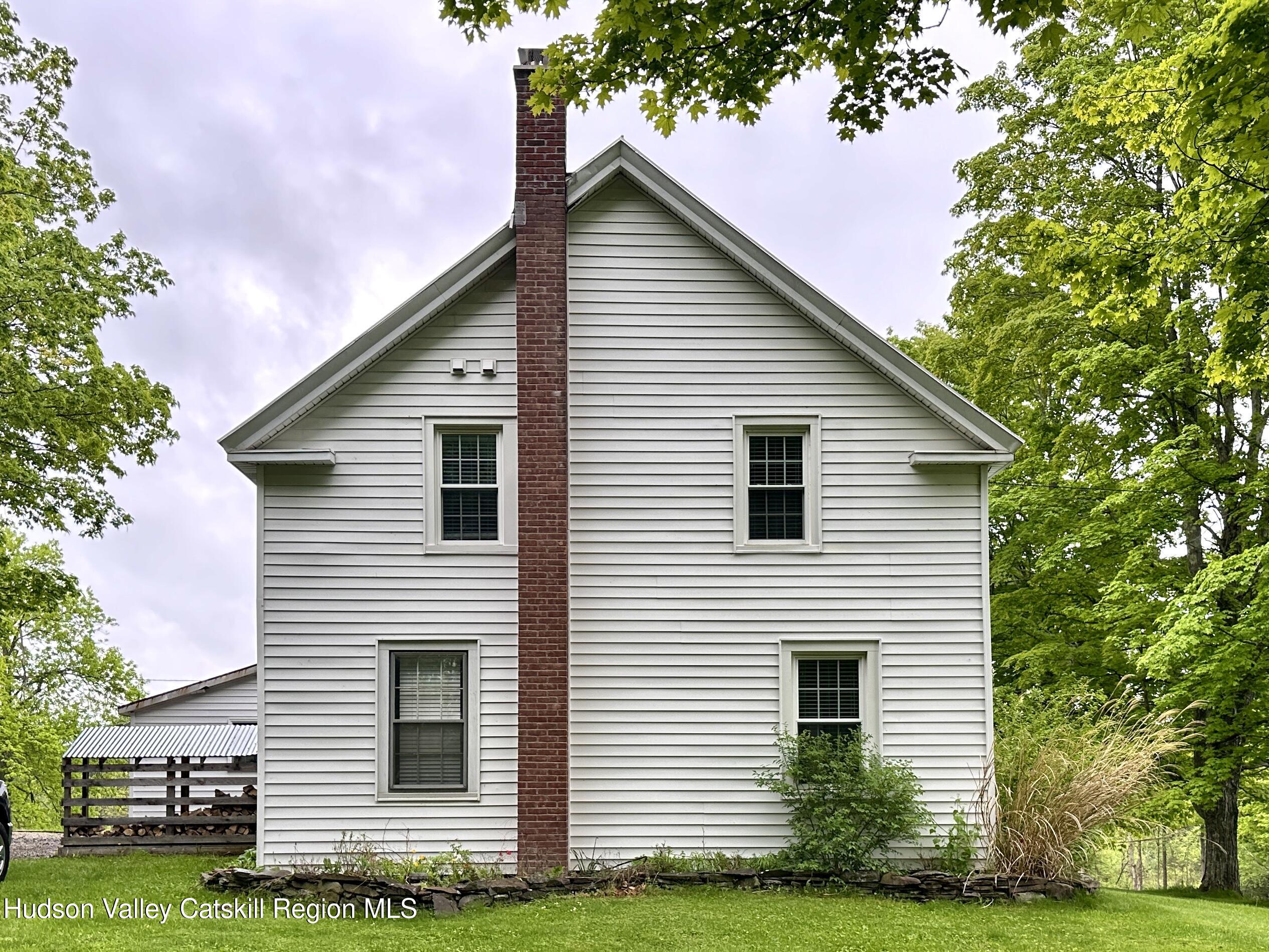 4028 County Rte 26 Greenville, NY 12083 - Photo 50 of 51 a front view of a house with a garden