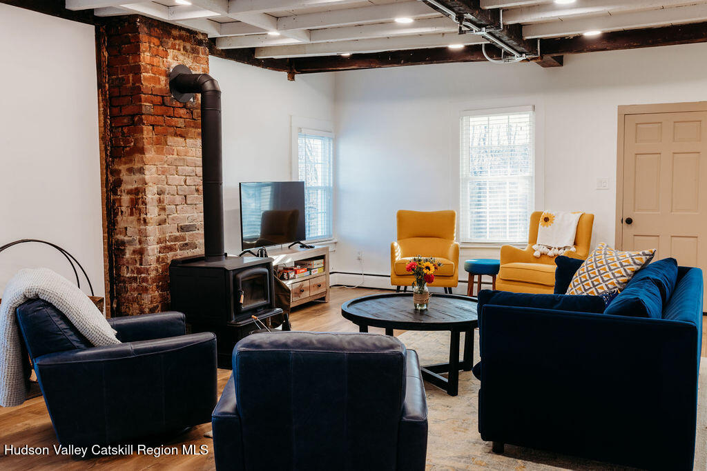 4028 County Rte 26 Greenville, NY 12083 - Photo 5 of 51 a living room with furniture and a flat screen tv