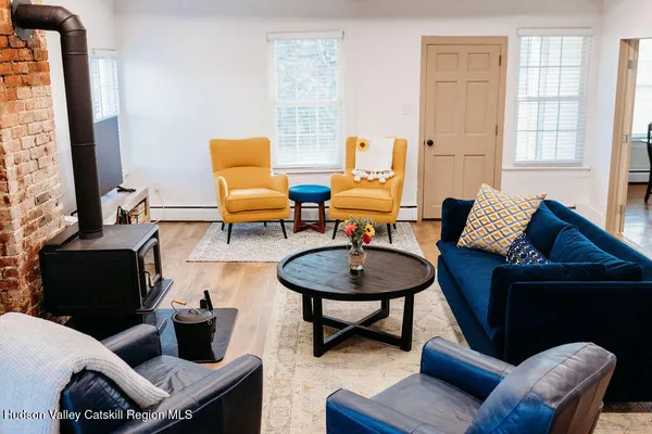 a living room with furniture and a lamp