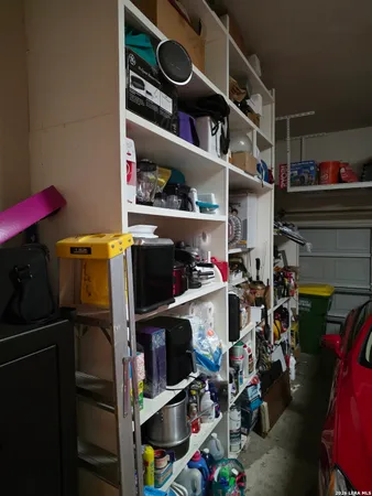 a view of storage and utility room with racks on the wall