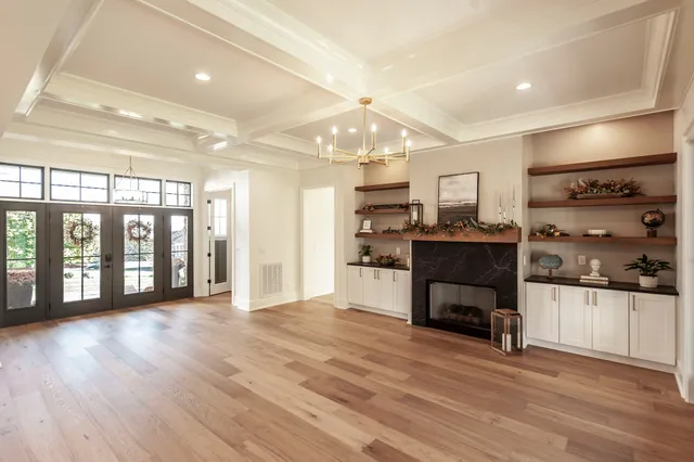 a kitchen with a sink and chandelier