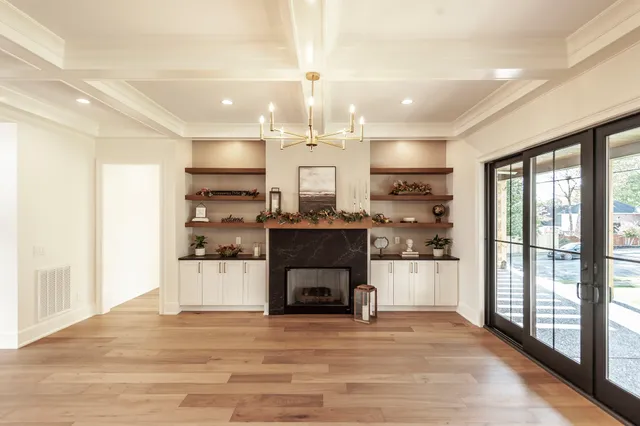 a bathroom with a granite countertop sink a potted plant and a window