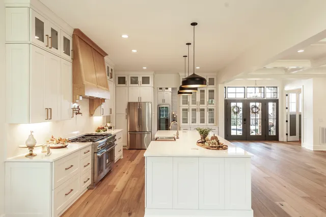 a bathroom with double vanity sinks and a mirror