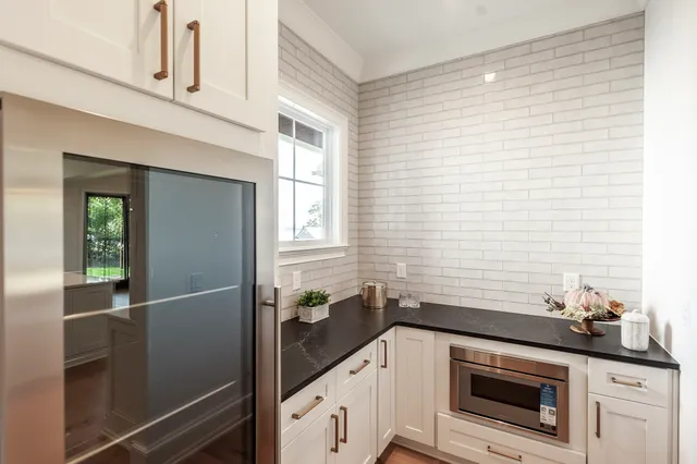 a bathroom with a toilet a sink and a mirror
