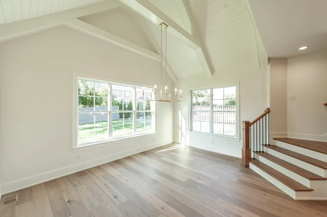 a bathroom with double vanity sinks a toilet a mirror and vanity