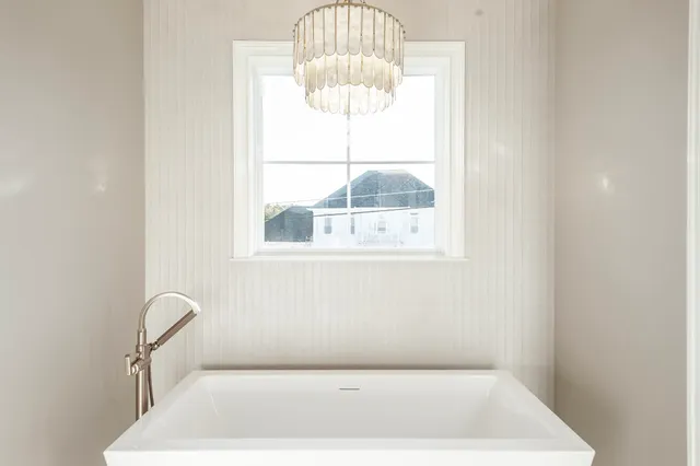 an aerial view of a house with a lake view