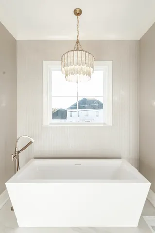 an aerial view of a house with a lake view