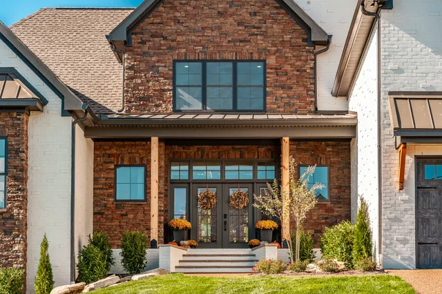 a view of a kitchen with furniture and wooden floor