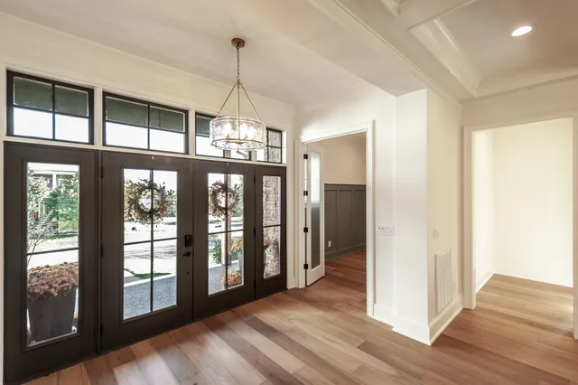 a kitchen with stainless steel appliances kitchen island granite countertop a stove a sink and a refrigerator