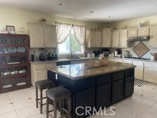 a kitchen with a sink cabinets and window