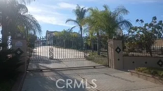 a view of a wrought iron fences in front of house